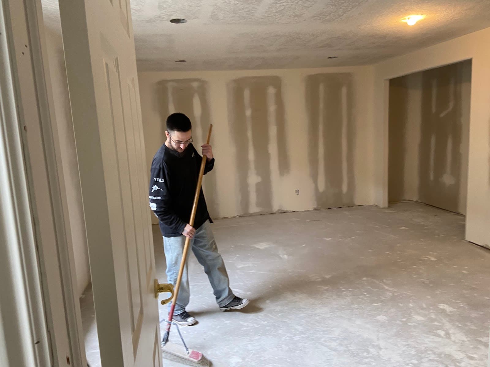 JS ProFinish crew finishing drywall in a basement