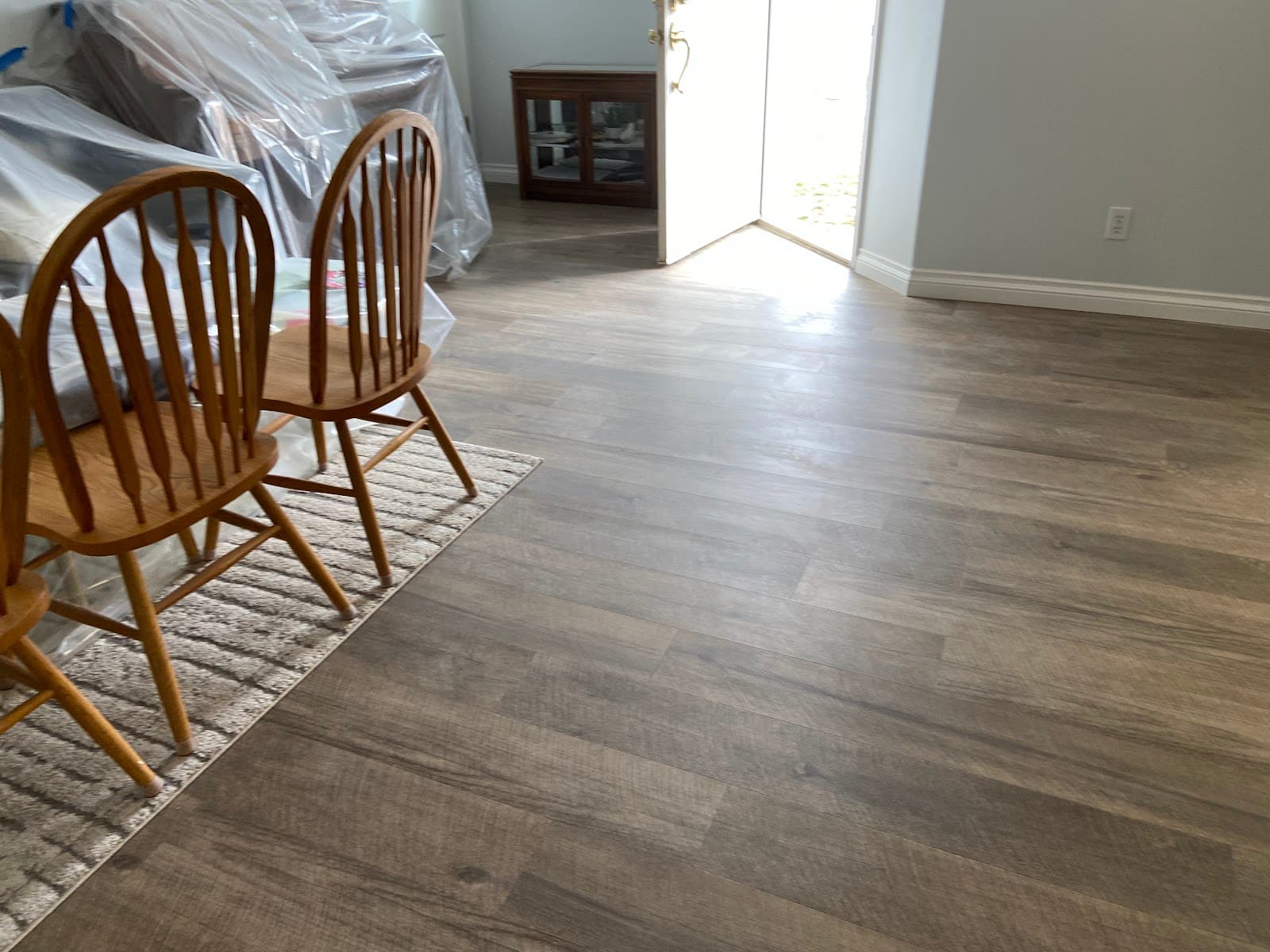 LVP flooring installed in a basement dining area