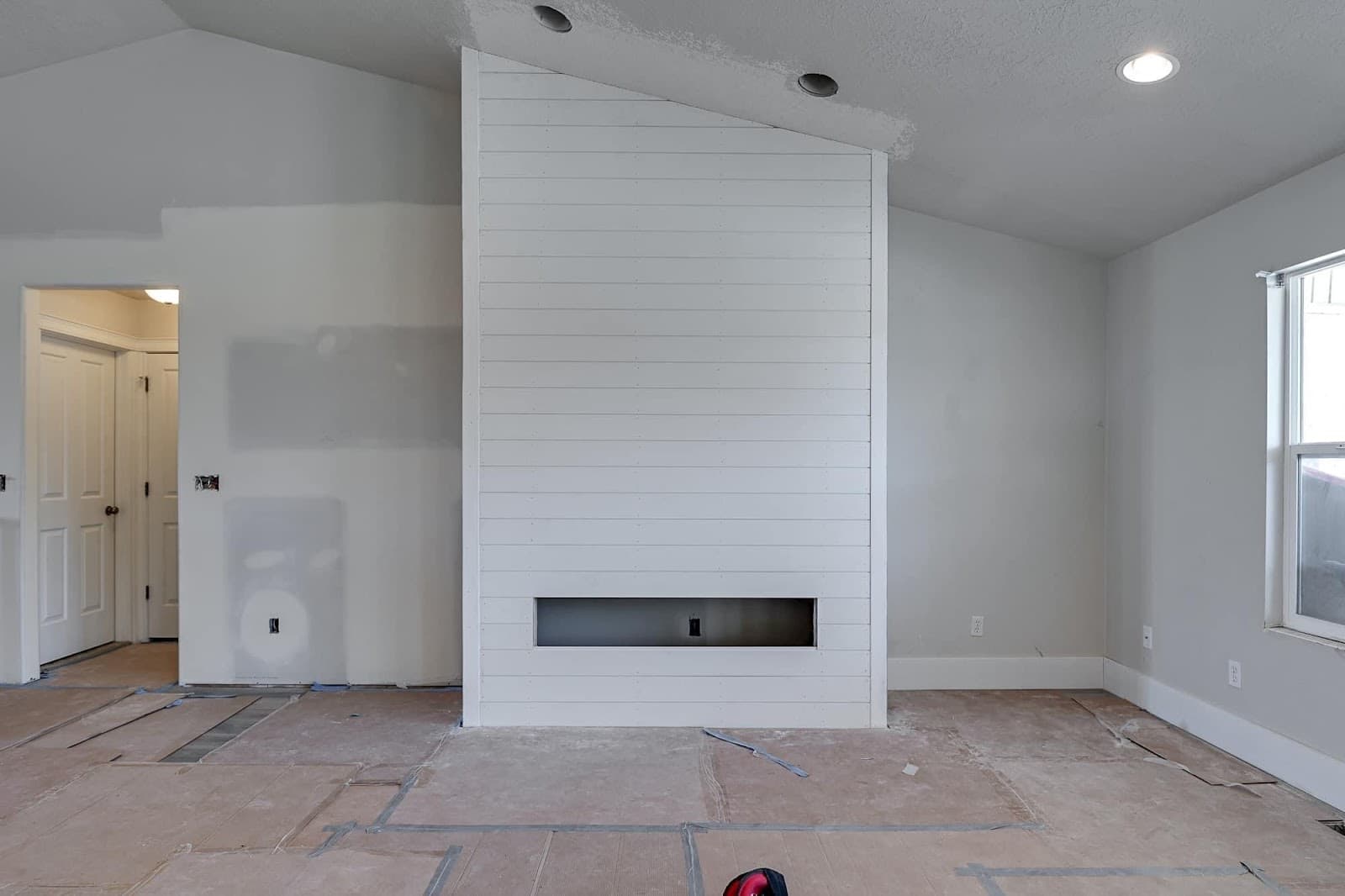 Shiplap fireplace surround built and painted by JS ProFinish