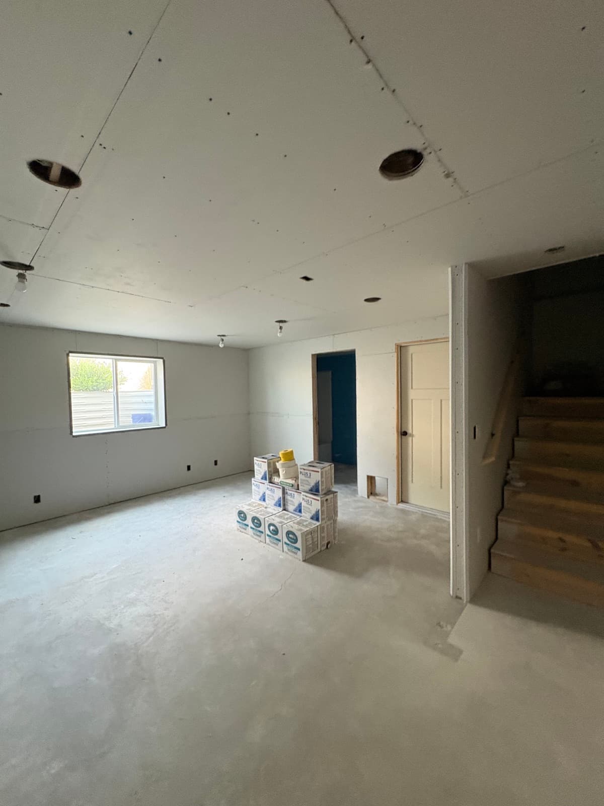 Drywall hung in a basement family room in Clinton, minutes from our Clearfield shop