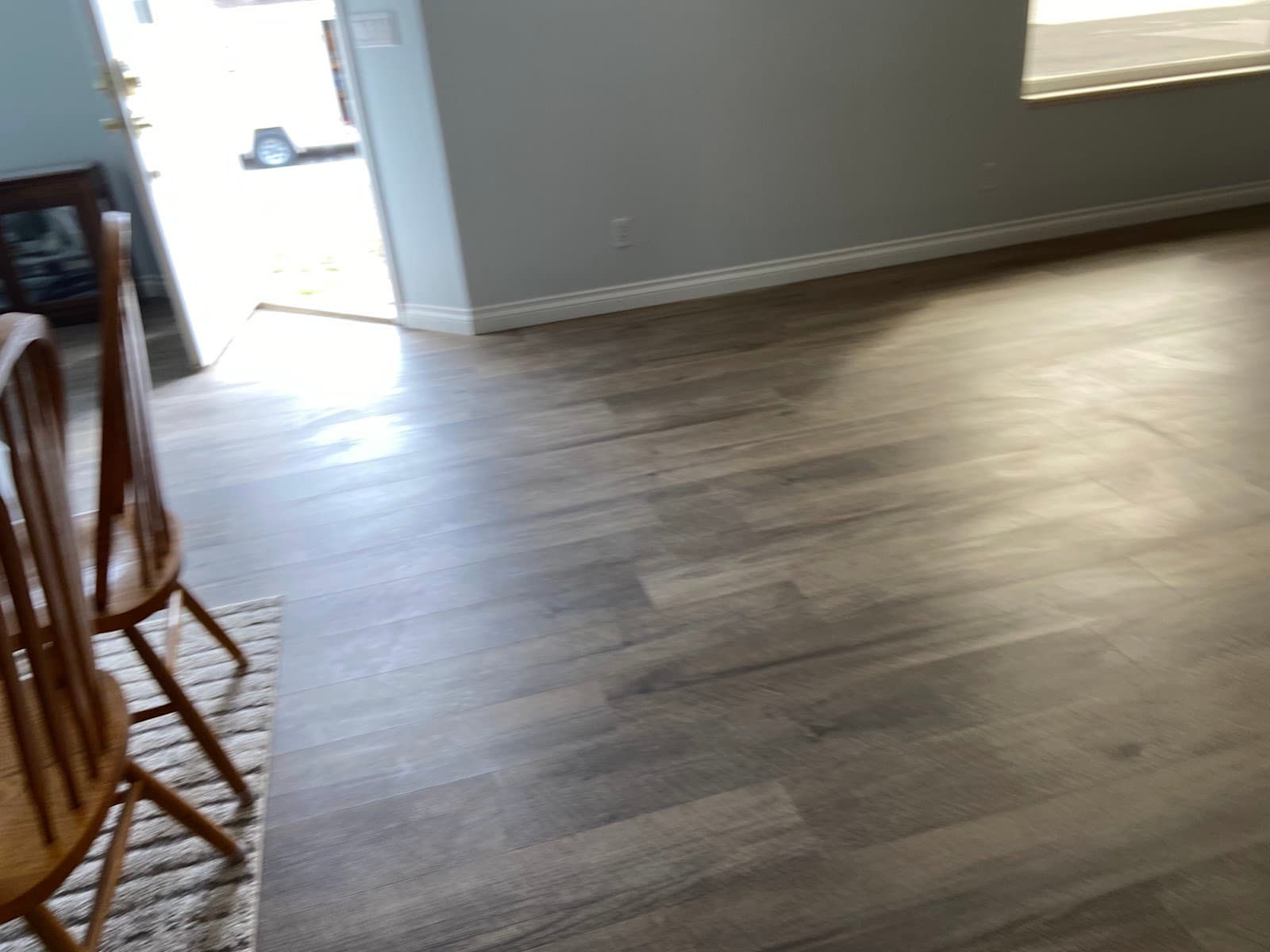 LVP flooring installed in a basement living area by JS ProFinish